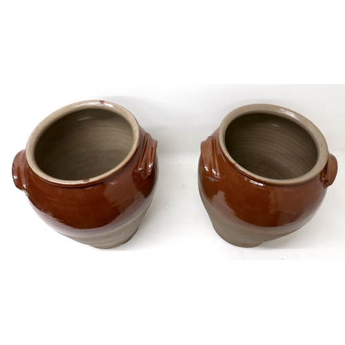 212 - A pair of early 20th century stoneware salting pots, with brown glaze to upper body, moulded applied... 