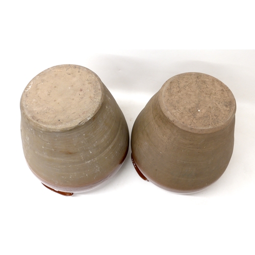 212 - A pair of early 20th century stoneware salting pots, with brown glaze to upper body, moulded applied... 