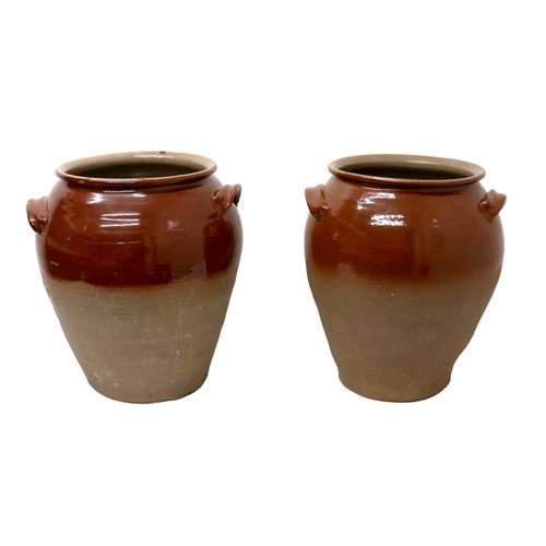 212 - A pair of early 20th century stoneware salting pots, with brown glaze to upper body, moulded applied... 