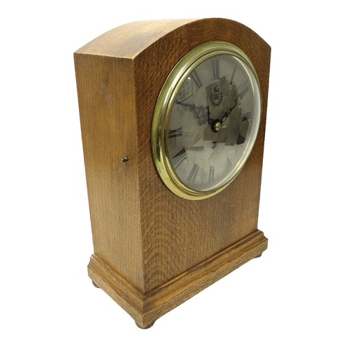 347 - A pre-WWII RAF oak cased mantel clock, the silvered dial engraved with the Royal Air Force insignia,... 