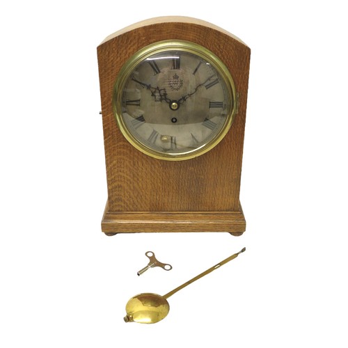 347 - A pre-WWII RAF oak cased mantel clock, the silvered dial engraved with the Royal Air Force insignia,... 