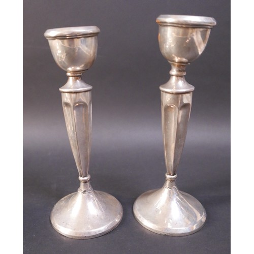 6 - A group of silver items, including a pair of weighted candlesticks, 19.5cm high, a continental white... 