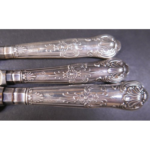 6 - A group of silver items, including a pair of weighted candlesticks, 19.5cm high, a continental white... 