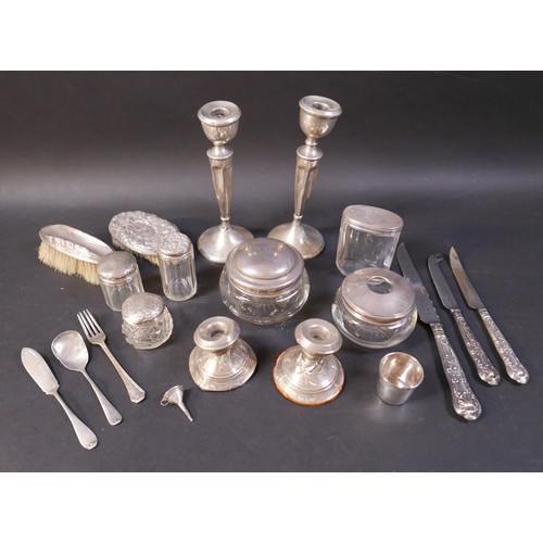 6 - A group of silver items, including a pair of weighted candlesticks, 19.5cm high, a continental white... 