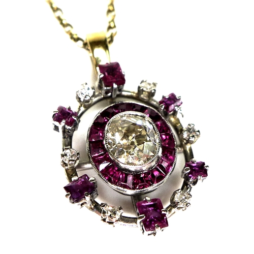 134 - A diamond and ruby pendant, formed of a central old oval cut diamond, 6.1 by 5.3 by 3.4mm, approxima... 