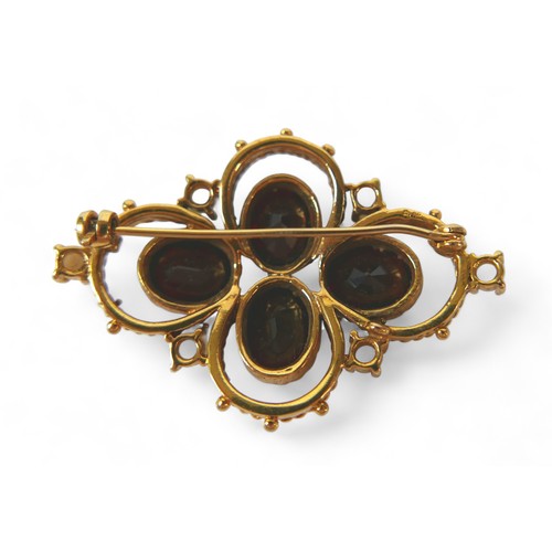 127 - A Victorian gold, garnet and pearl brooch, set with four oval garnets and six pearls on fancy ropetw... 