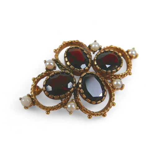 127 - A Victorian gold, garnet and pearl brooch, set with four oval garnets and six pearls on fancy ropetw... 