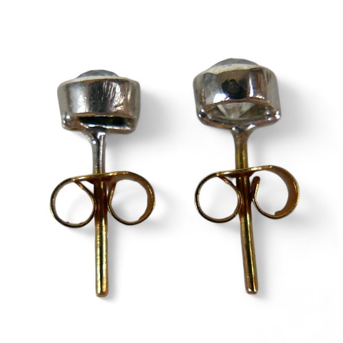 133 - A pair of diamond solitaire earring studs, on gold backs, each diamond approx. 0.3ct.