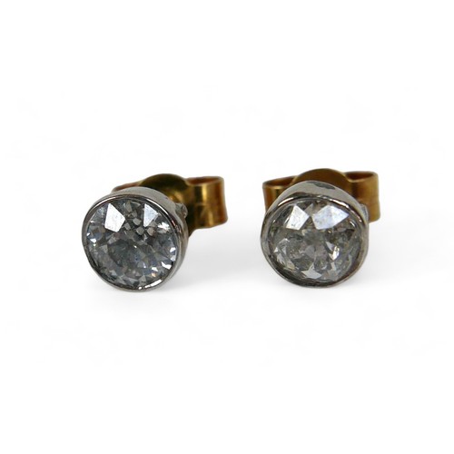 133 - A pair of diamond solitaire earring studs, on gold backs, each diamond approx. 0.3ct.