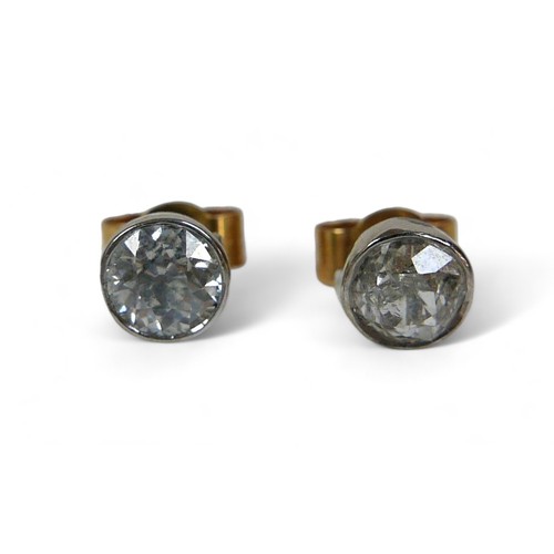 133 - A pair of diamond solitaire earring studs, on gold backs, each diamond approx. 0.3ct.