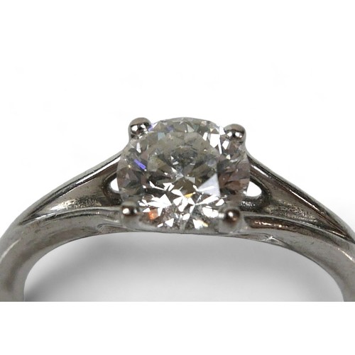 153 - An 18ct white gold Hearts On Fire diamond solitaire ring, the band with V shoulders, the brilliant c... 