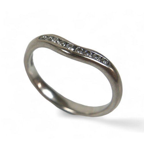 138 - An 18ct white gold and diamond wishbone ring, set with nine brilliant-cut diamonds, size Q.