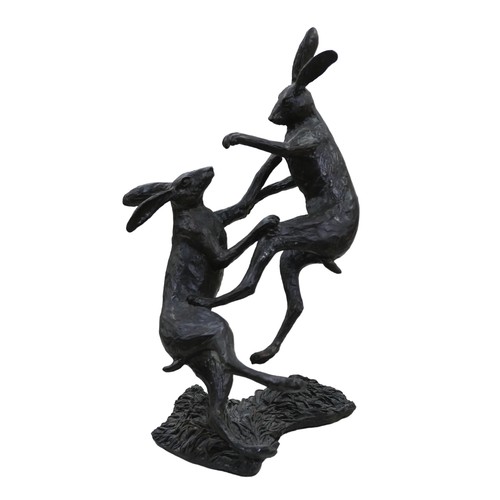 267 - A Bowmore Studios limited edition bronzed figural group of two boxing hares, numbered '32/100', make... 