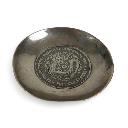 63 - A silver Chinese Pei Yang coin dish, 6.5 cm diameter by 1cm high, 39.7gs.