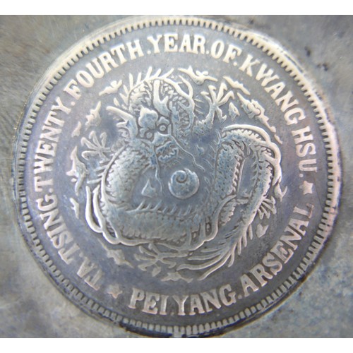 63 - A silver Chinese Pei Yang coin dish, 6.5 cm diameter by 1cm high, 39.7gs.