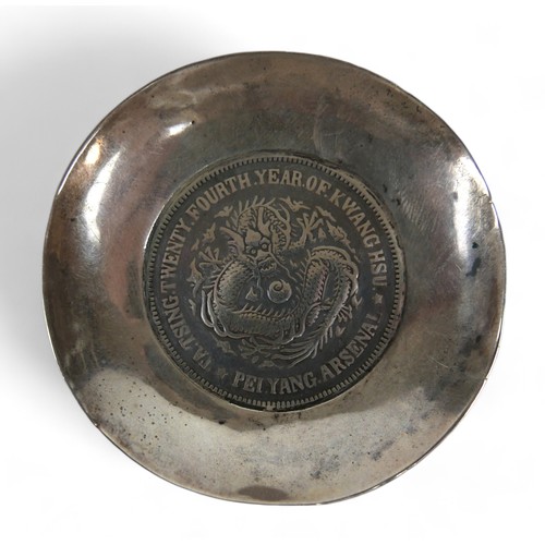 63 - A silver Chinese Pei Yang coin dish, 6.5 cm diameter by 1cm high, 39.7gs.