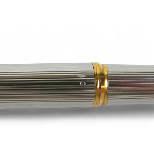 338 - A Waterman silver and gilt cartridge ink pen with an 18ct yellow gold nib 14cm long, with box.