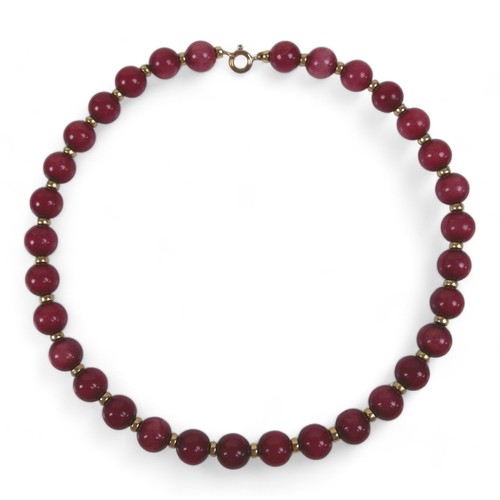 101 - A two-strand pearl necklace with 9ct gold clasp, a Heidi Kjeldsen red agate bead necklace (enhanced ... 