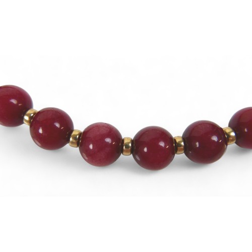 101 - A two-strand pearl necklace with 9ct gold clasp, a Heidi Kjeldsen red agate bead necklace (enhanced ... 