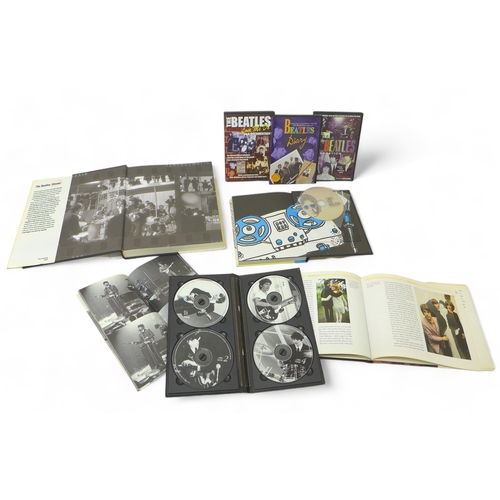 299 - A collection of three books relating the The Beatles, comprising The Beatles Unseen by Mark Hayward,... 