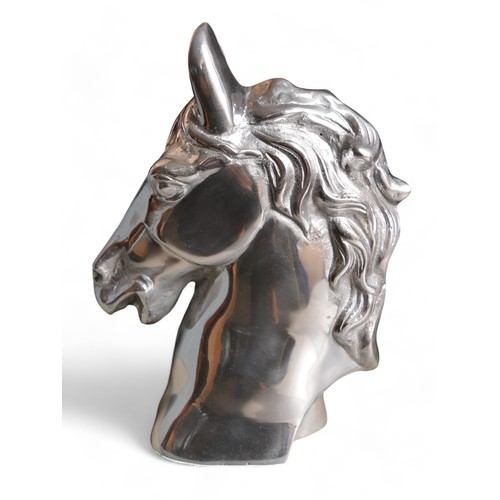 268 - A modern white metal sculpture of a horse’s head, 16 by 36 by 46cm high.