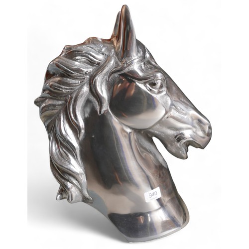 268 - A modern white metal sculpture of a horse’s head, 16 by 36 by 46cm high.