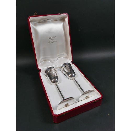 33 - A pair of Les Must de Cartier silver champagne flutes, circa 1990s, with gold, rose gold, and silver... 