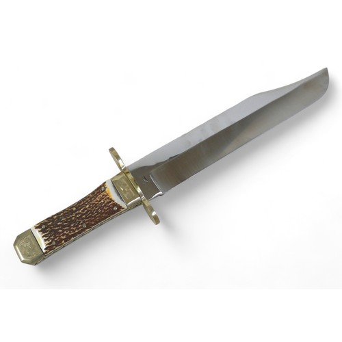 292 - A Stan Shaw hunting knife, with horn handle and fitted leather sheath, 48.5cm long.