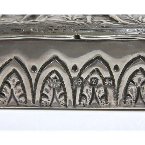 10 - A late 19th century silver ring box, with relief decoration of a mythological scene of people playin... 