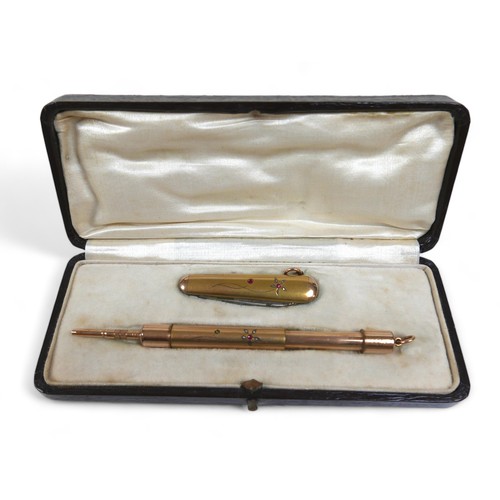 285 - A cased, gold plated, fruit knife and propelling pencil set, with red stone and seed pearl decoratio... 