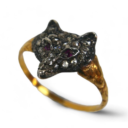 121 - A Victorian diamond and ruby fox head ring, 22 rose cut diamonds cover the face with two ruby chips ... 