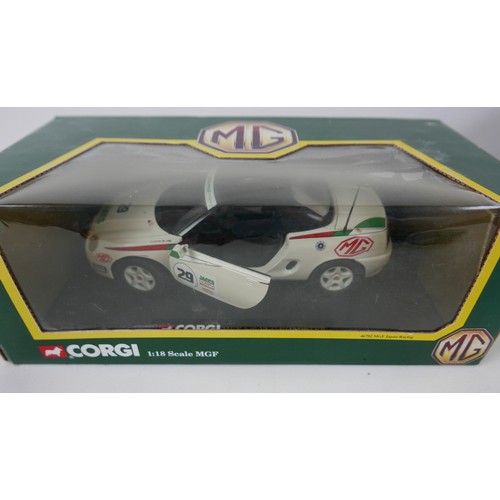 329 - A collection of six 1/18 scale model vehicles, comprising a boxed Corgi MGF, a boxed Mattel Hot Whee... 