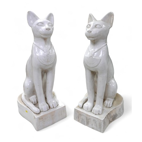 230 - A pair of large ceramic crackle glaze figures, each modelled as a seated Egyptian cat, 26 by 37 by 7... 