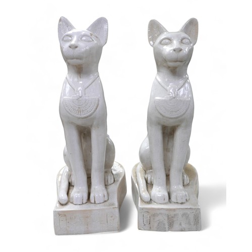 230 - A pair of large ceramic crackle glaze figures, each modelled as a seated Egyptian cat, 26 by 37 by 7... 