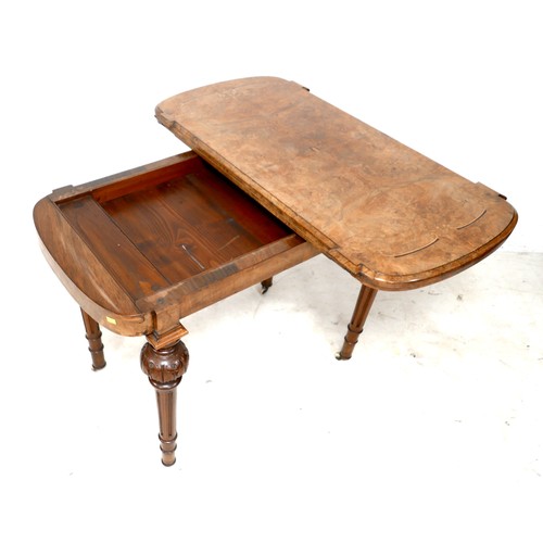 539 - A Victorian walnut fold over card table, with swivel top, inlaid decoration, raised on column suppor... 