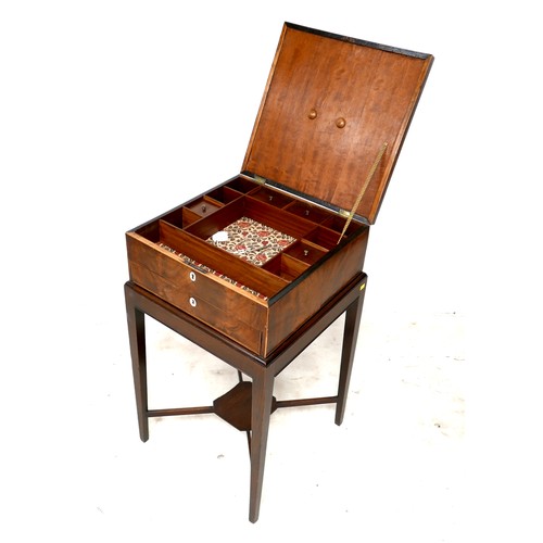 536 - A Georgian mahogany jewellery box on stand, with slender supports joined by an X stretcher, 43 by 43... 