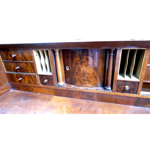 537 - A 19th century Continental walnut roll top bureau, with brushing slide over three drawers, raised on... 