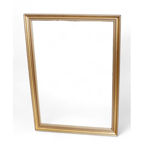 277 - A modern gilt framed wall mirror, rectangular plate, 71 by 100cm.