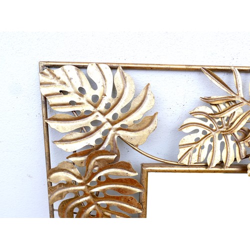 295 - A modern brass effect mirror, with cheese plant leaf border, rectangular, 80 by 132cm high.