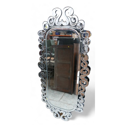 300 - An oval modern Venetian style mirror, 70 by 151cm high.