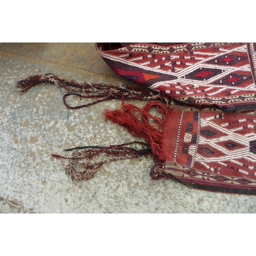 337 - A flat weave decorative tent frieze, with red ground, black and white diamond patterned design, 32 b... 