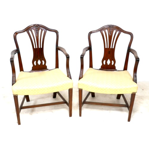 283 - A pair of Regency style mahogany carver chairs, with pierced splats, upholstered in pale cream strip... 