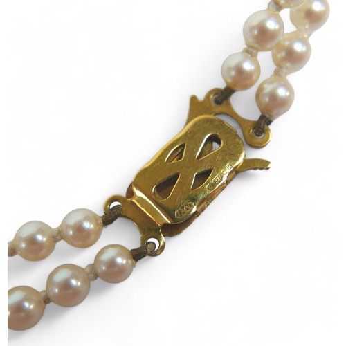 69 - A two-strand pearl necklace with 9ct gold clasp, a Heidi Kjeldsen red agate bead necklace (enhanced ... 