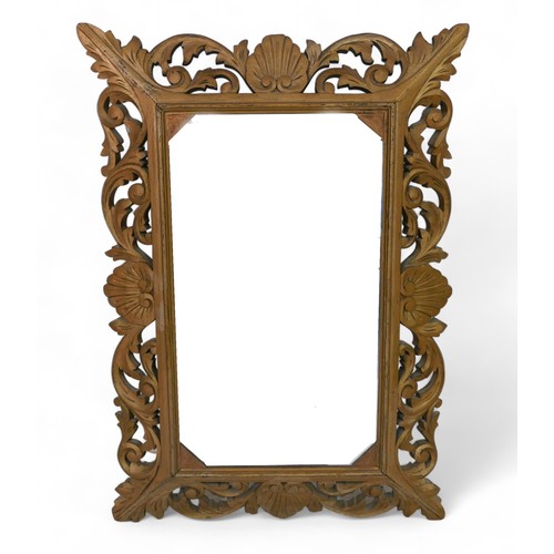 291 - An ornate gilt wood wall mirror, with acanthus scroll decoration, 58 by 6 by 85cm.