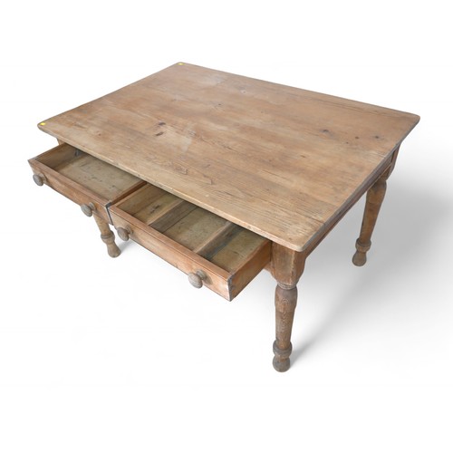 342 - A Victorian stripped pine two drawer table, on turned legs, 121 by 81 by 74cm high.