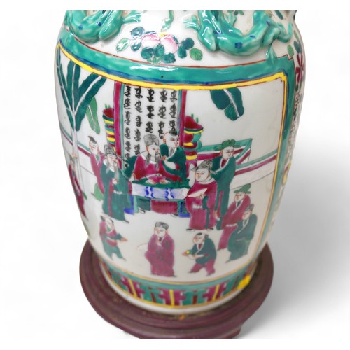 111 - A pair of Chinese Canton porcelain vases, both with drill hole lamp conversion, larger with fittings... 