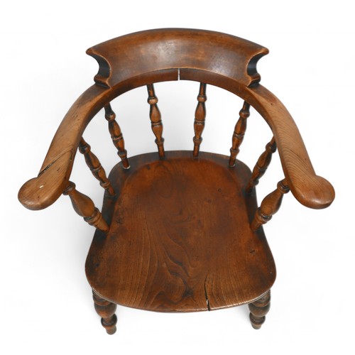 325 - A Victorian ash and elm captains desk chair, 64 by 58 by 74cm high.