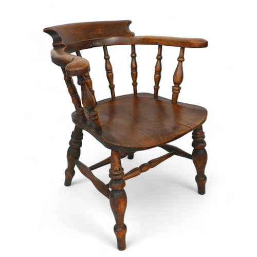 325 - A Victorian ash and elm captains desk chair, 64 by 58 by 74cm high.