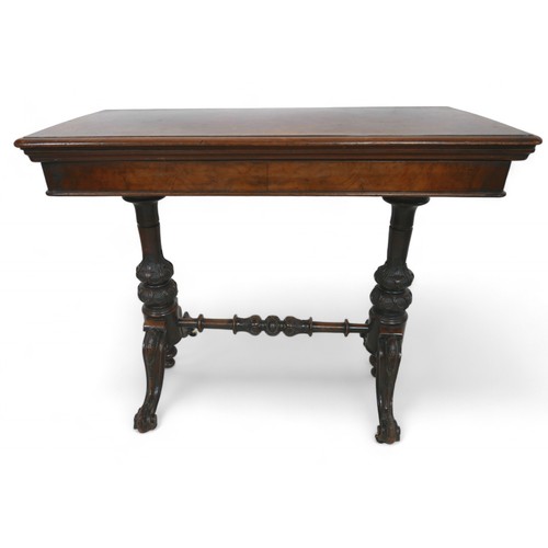 344 - A Victorian burr walnut fold over top card table, on turned and carved pillar supports united by a t... 