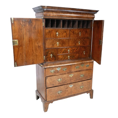 365 - A George I / George II walnut cabinet on chest, with a cushion drawer above two doors enclosing a fi... 